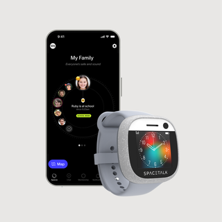A smartphone displaying a family tracking app next to a gray SPACETALK smartwatch with a colorful clock face.