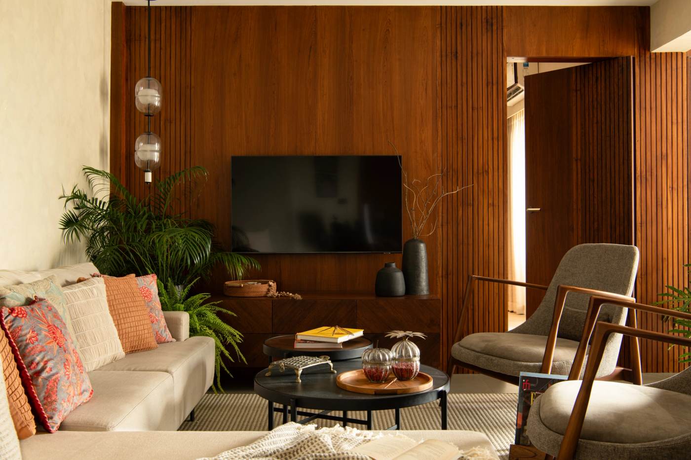 A panelled living space with a timber screen