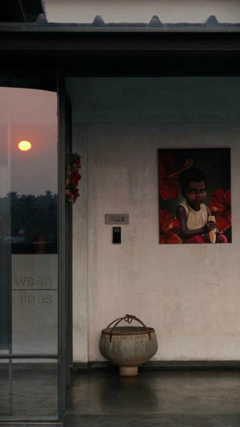 The btl studio entrance at dusk, the practice's name etched into the glass