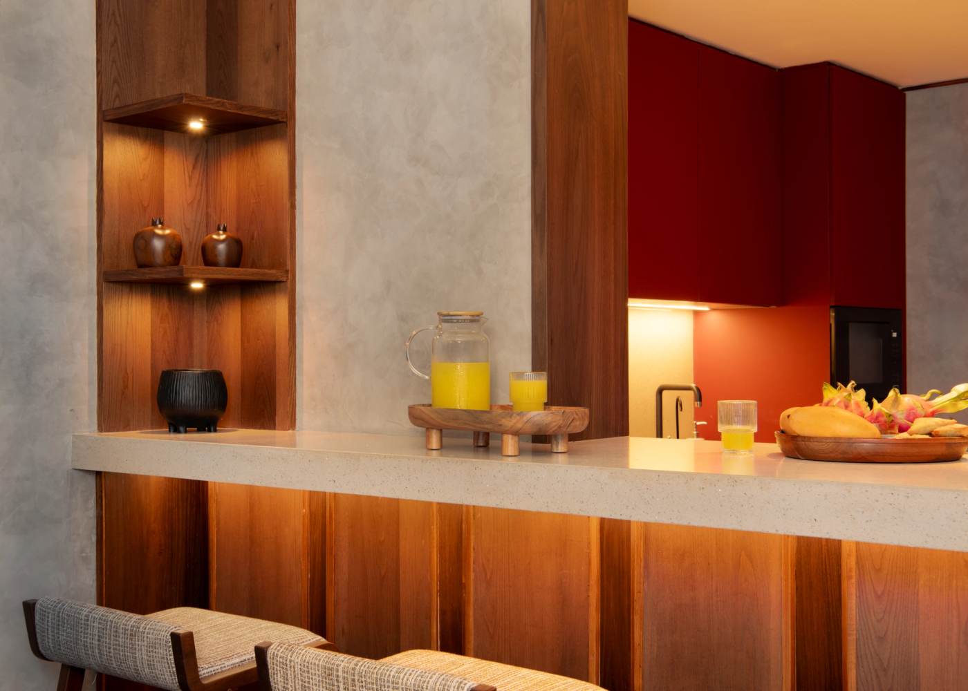 The kitchen counter in terrazzo, red cabinets behind