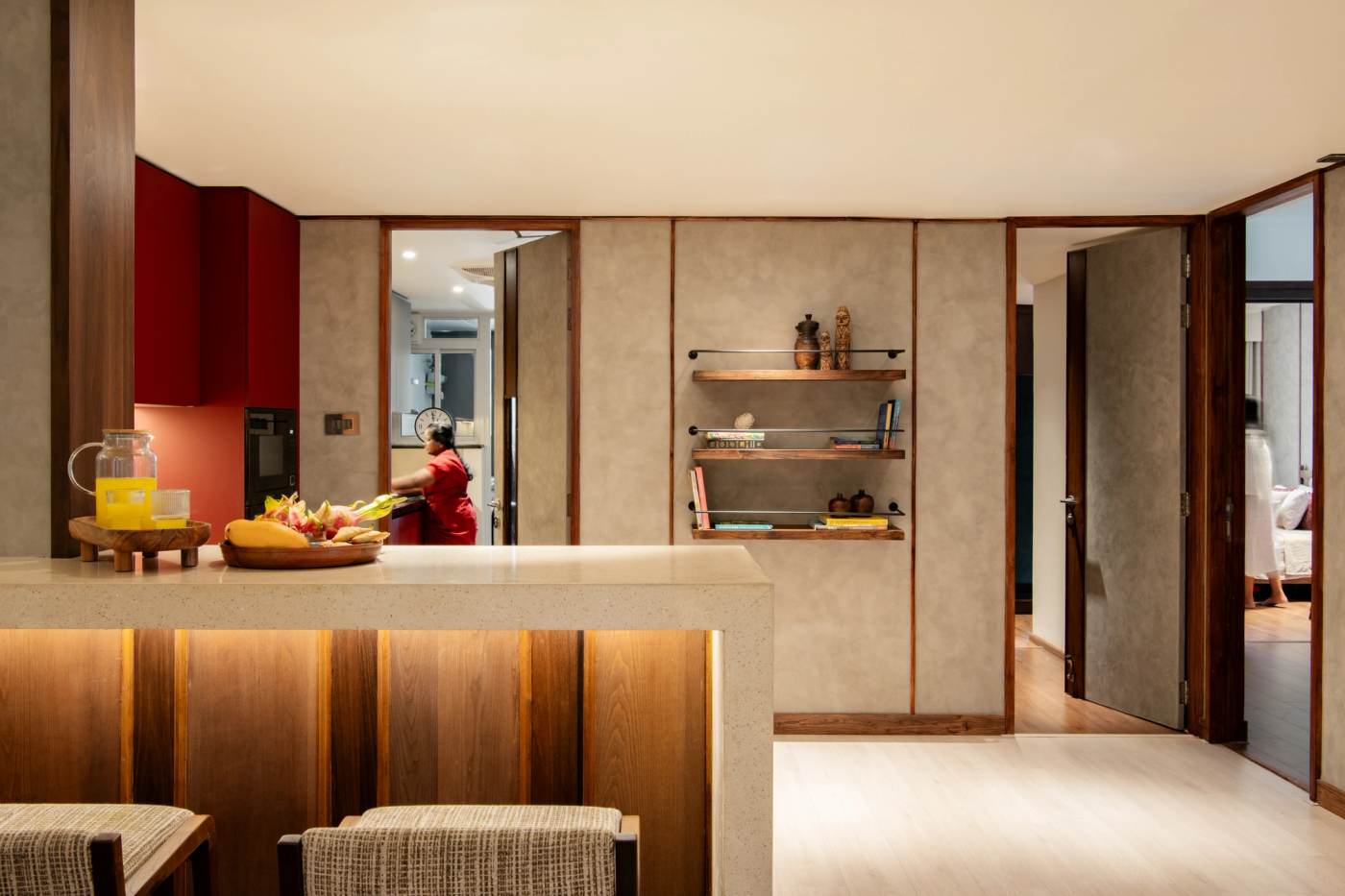 The breakfast counter, with the kitchen beyond and doors to the bedrooms
