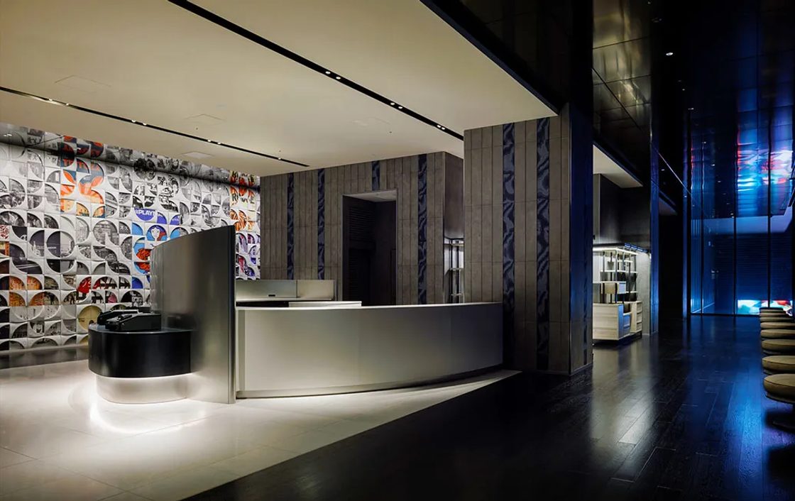 The reception desk and lobby corridor at HOTEL GROOVE SHINJUKU