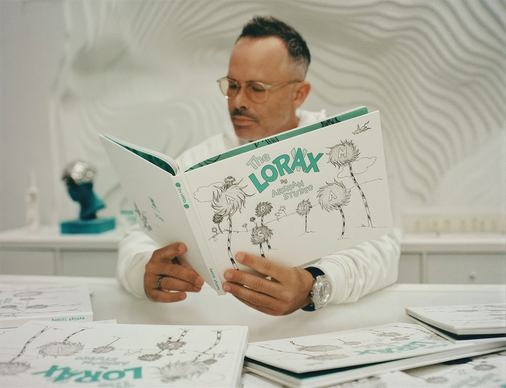 Daniel Arsham reading a book