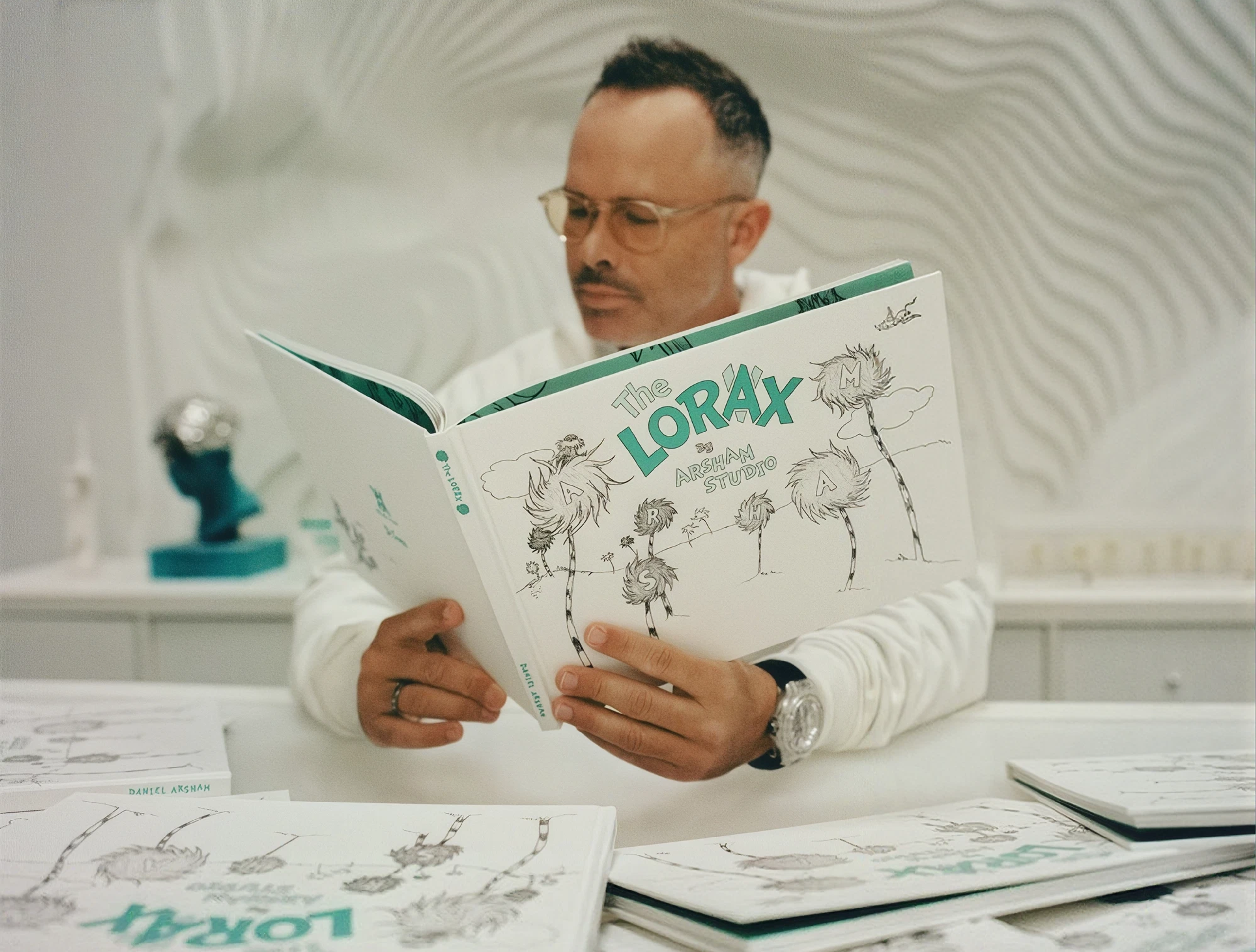 Daniel Arsham reading a book