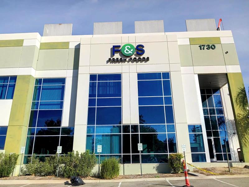 Dimensional logo and letters installed high on a modern office building facade for F&S Fresh Foods
