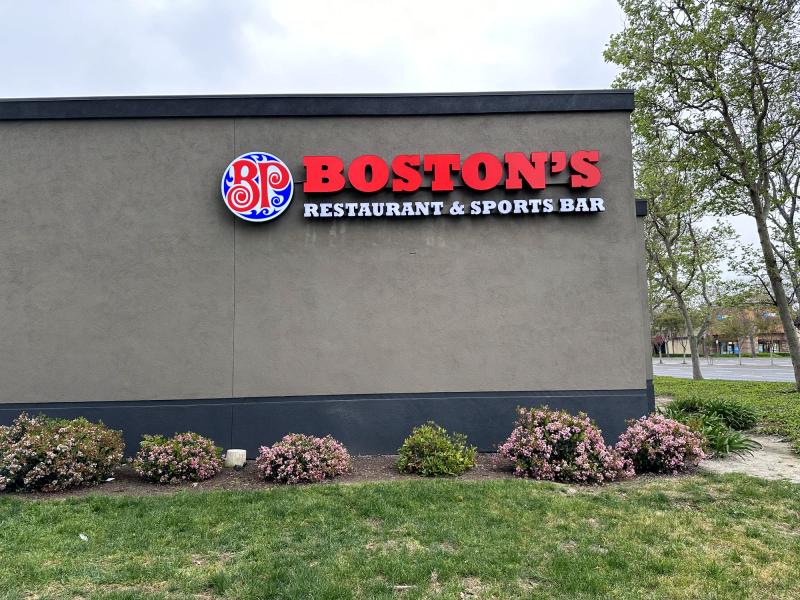 Boston's Restaurant & Sports Bar wall-mounted channel letter set, side elevation with landscaping