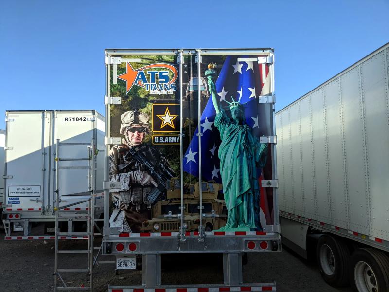 Full-color printed trailer wrap honoring the U.S. Army with soldier and Statue of Liberty artwork