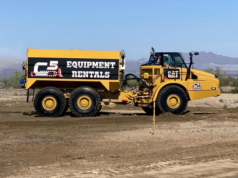 C5 Equipment Rentals branding on a CAT articulated dump truck on a job site