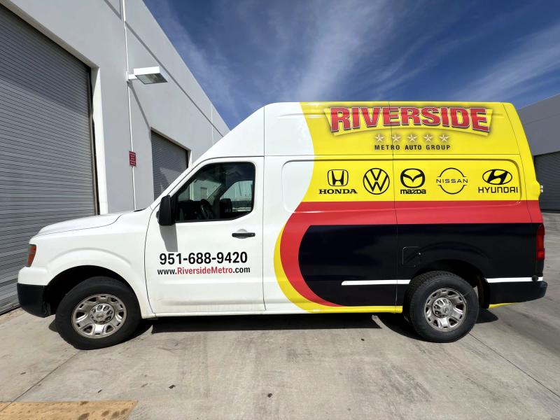Full-color van wrap for Riverside Metro Auto Group with dealership brand logos