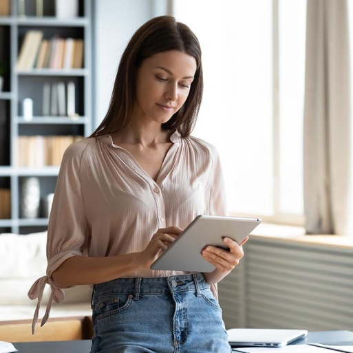 Woman checking her social media accounts on her iPad.