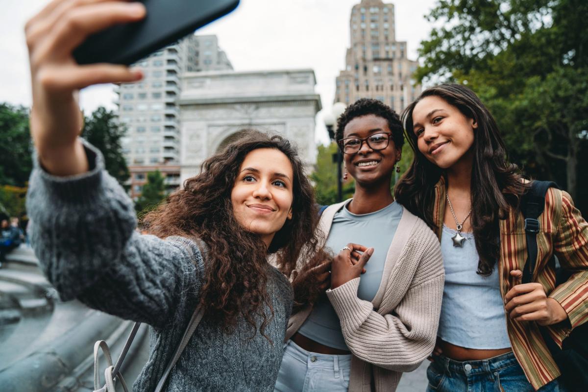 Group of young people taking a selfie.