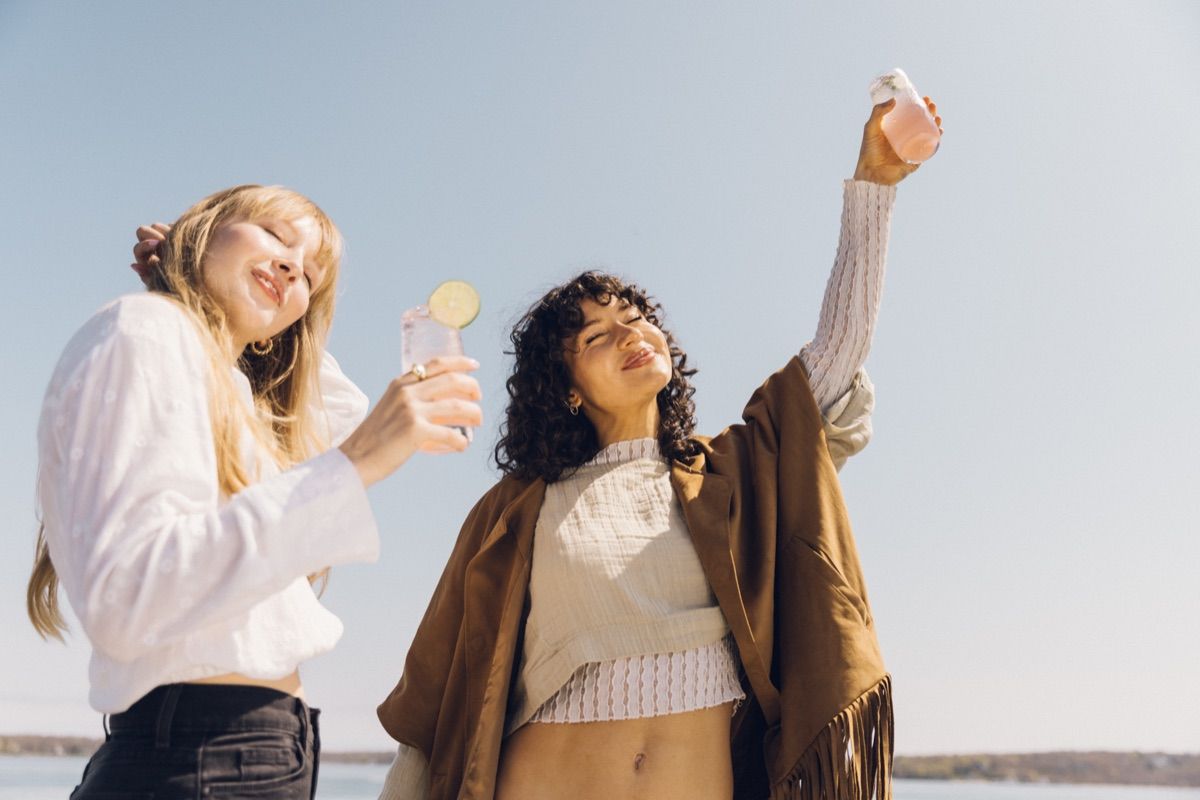 Friends toasting on the waterfront deck