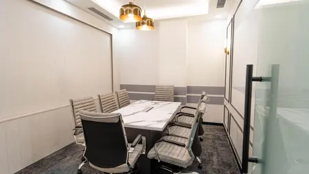Meeting room with a marble-top table, grey leather chairs and brass pendant lights, AIHP SCO 34, Sector 32 Gurgaon