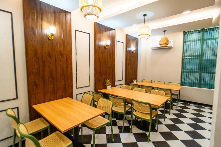 Cafe and breakout dining area at an AIHP Sector 32 office, Gurgaon