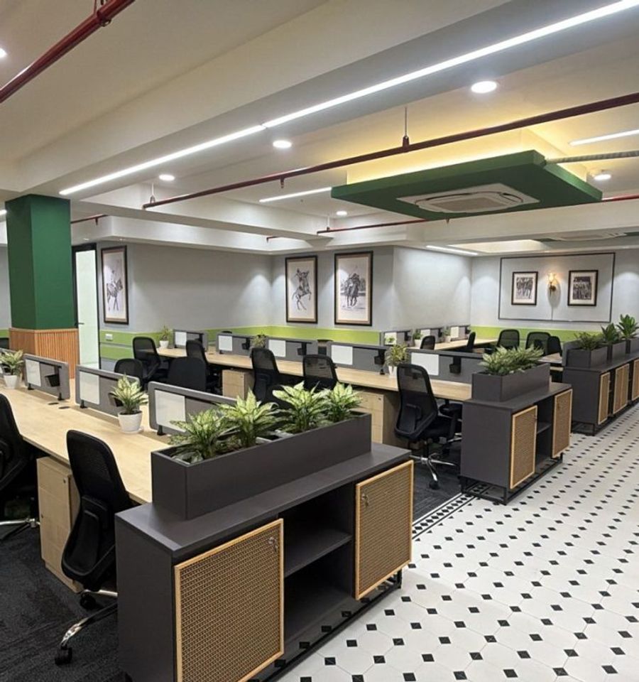 Open-plan managed workspace with rows of workstations at AIHP Cyber Greens 2