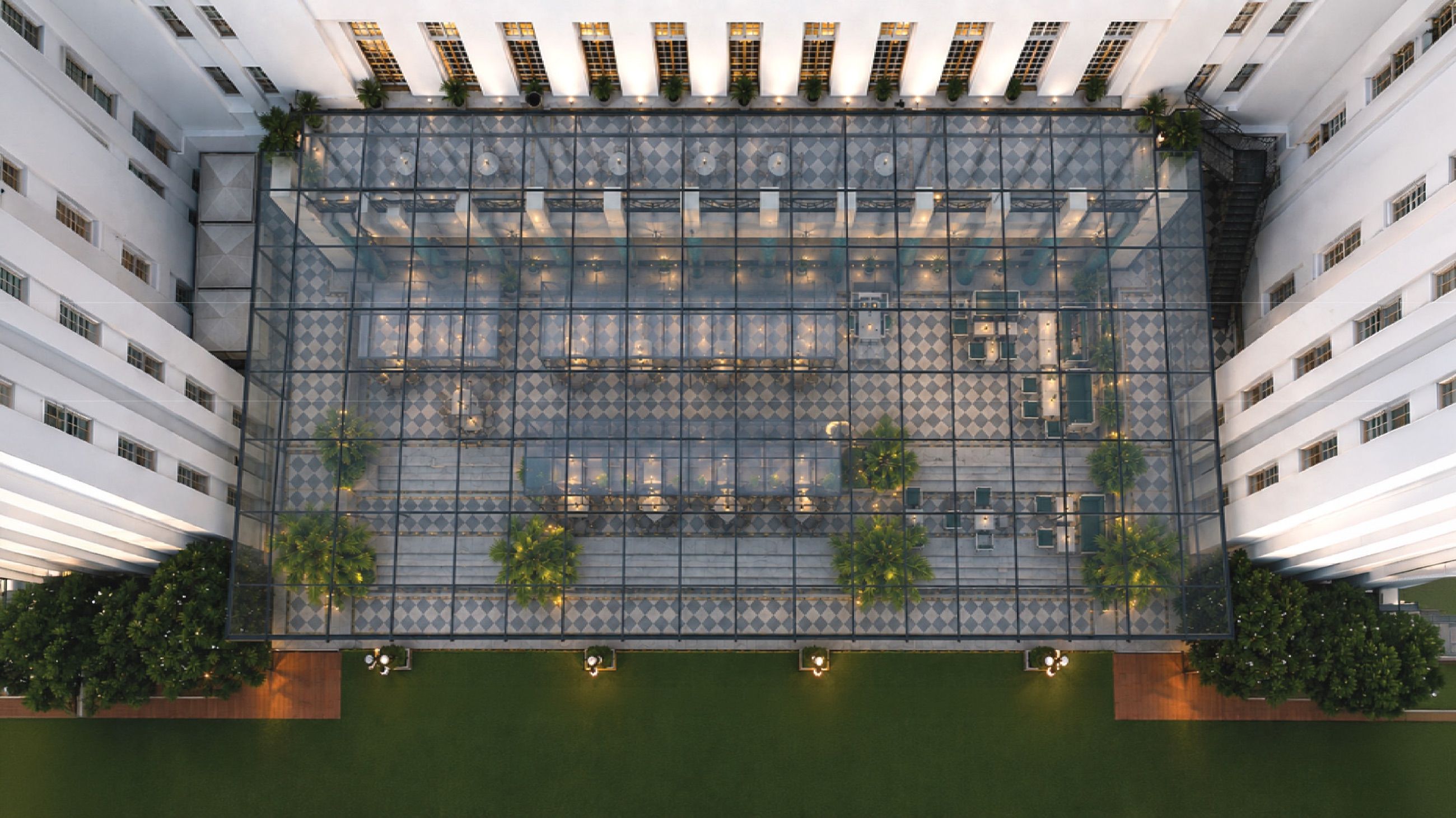 Aerial view of the glass-roofed dining atrium and lawns at AIHP Imperial, Sector 32 Gurgaon