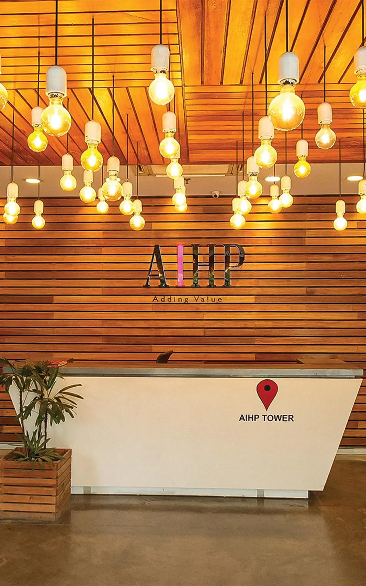 AIHP Tower reception with backlit branding, Udyog Vihar Gurgaon