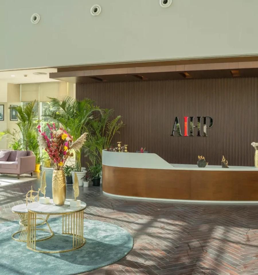 Reception desk and lobby at an AIHP Sector 32 office, Gurgaon