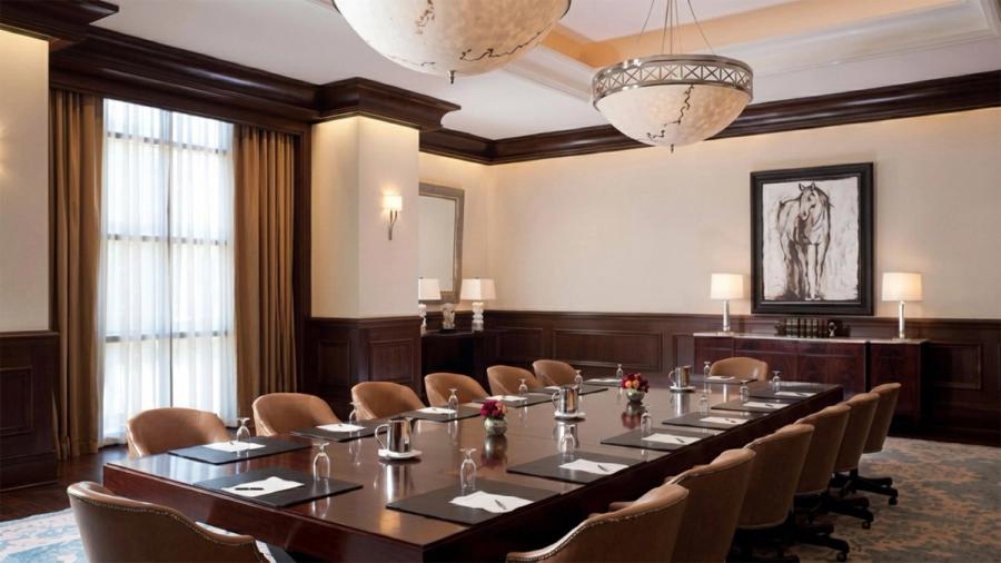 Wood-panelled boardroom with a sixteen-seat table at AIHP Imperial, Sector 32 Gurgaon