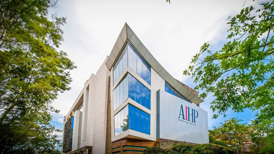 AIHP Broadway building exterior with glass facade and rooftop AIHP signage