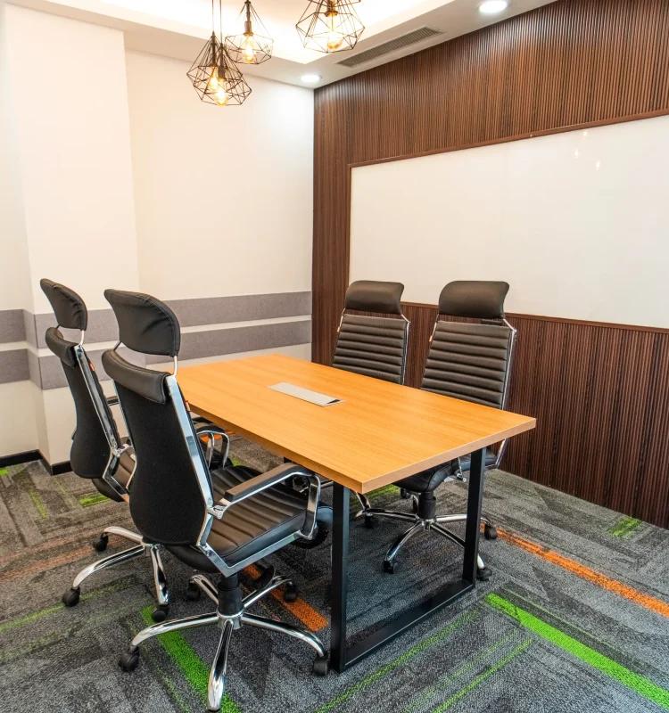 Four-seat meeting room with wood table, whiteboard and slatted wood wall, AIHP SCO 27, Sector 32 Gurgaon