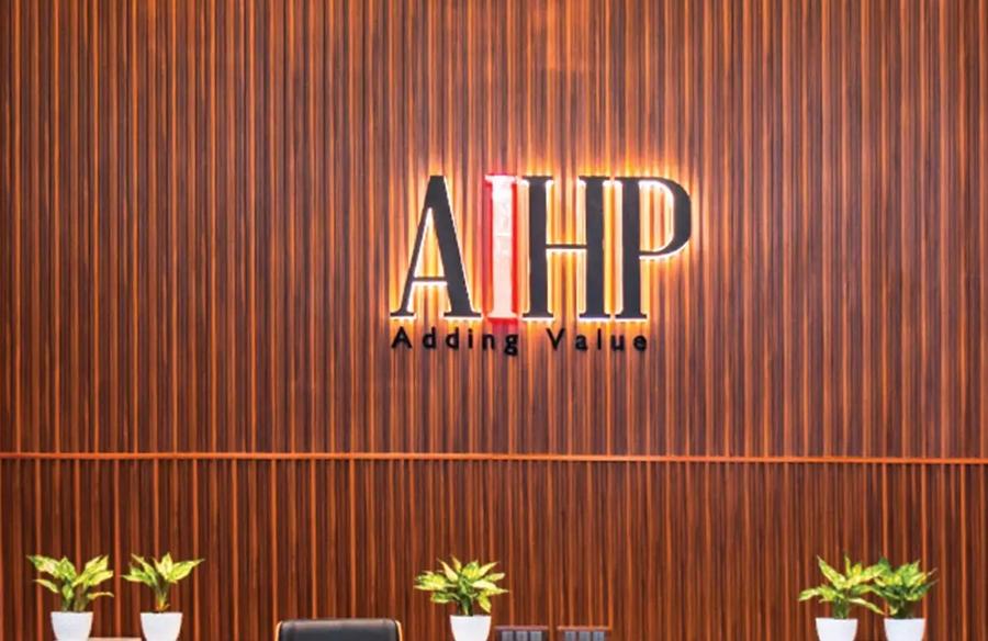AIHP Millennium reception with marble desk and backlit branding, Udyog Vihar Gurgaon