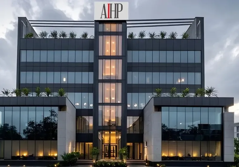 AIHP One Grade-A office tower facade at dusk, Golf Course Extension Road, Gurgaon