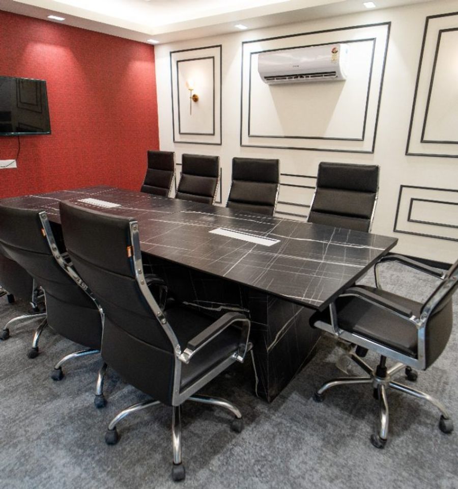 Conference room with framed artwork on panelled walls at AIHP Cyber Greens 2