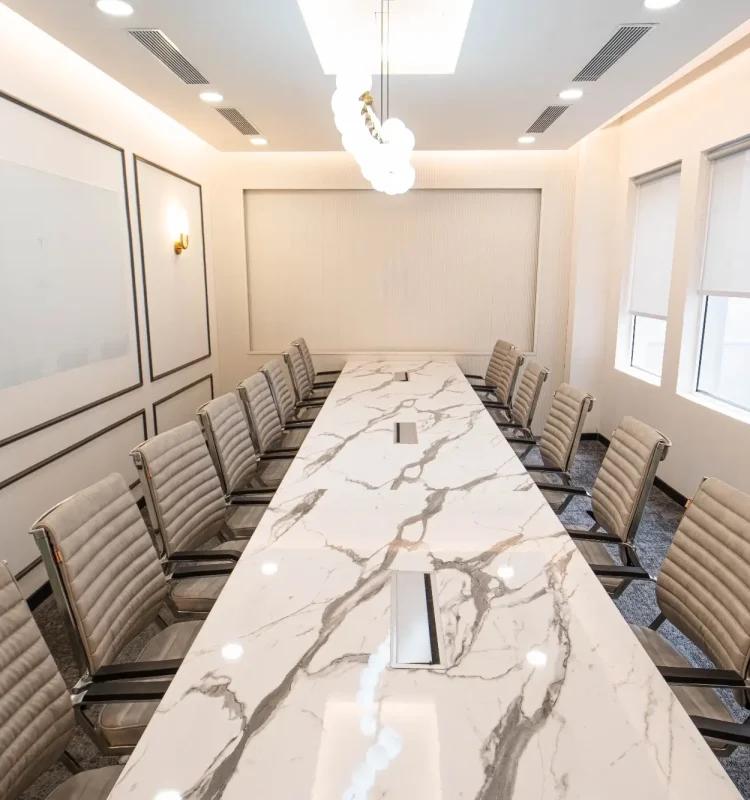 Marble boardroom table with 14 beige ribbed chairs and globe chandelier, AIHP SCO 27, Sector 32 Gurgaon