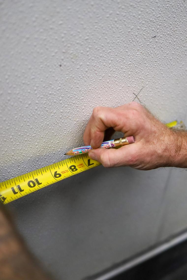 ProTech technician documenting wall repair