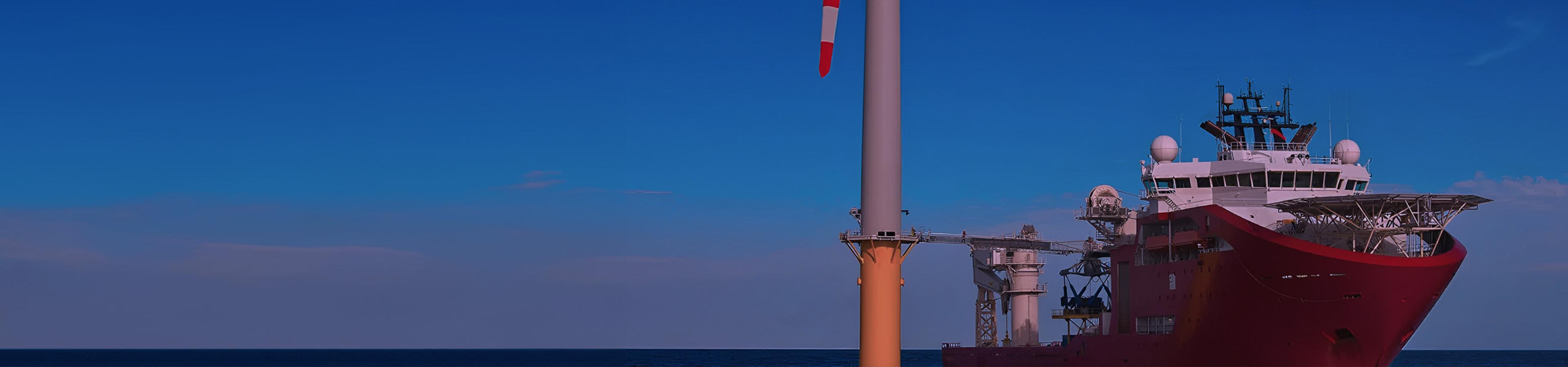 picture of a ship connected to an offshore wind turbine with a gangway