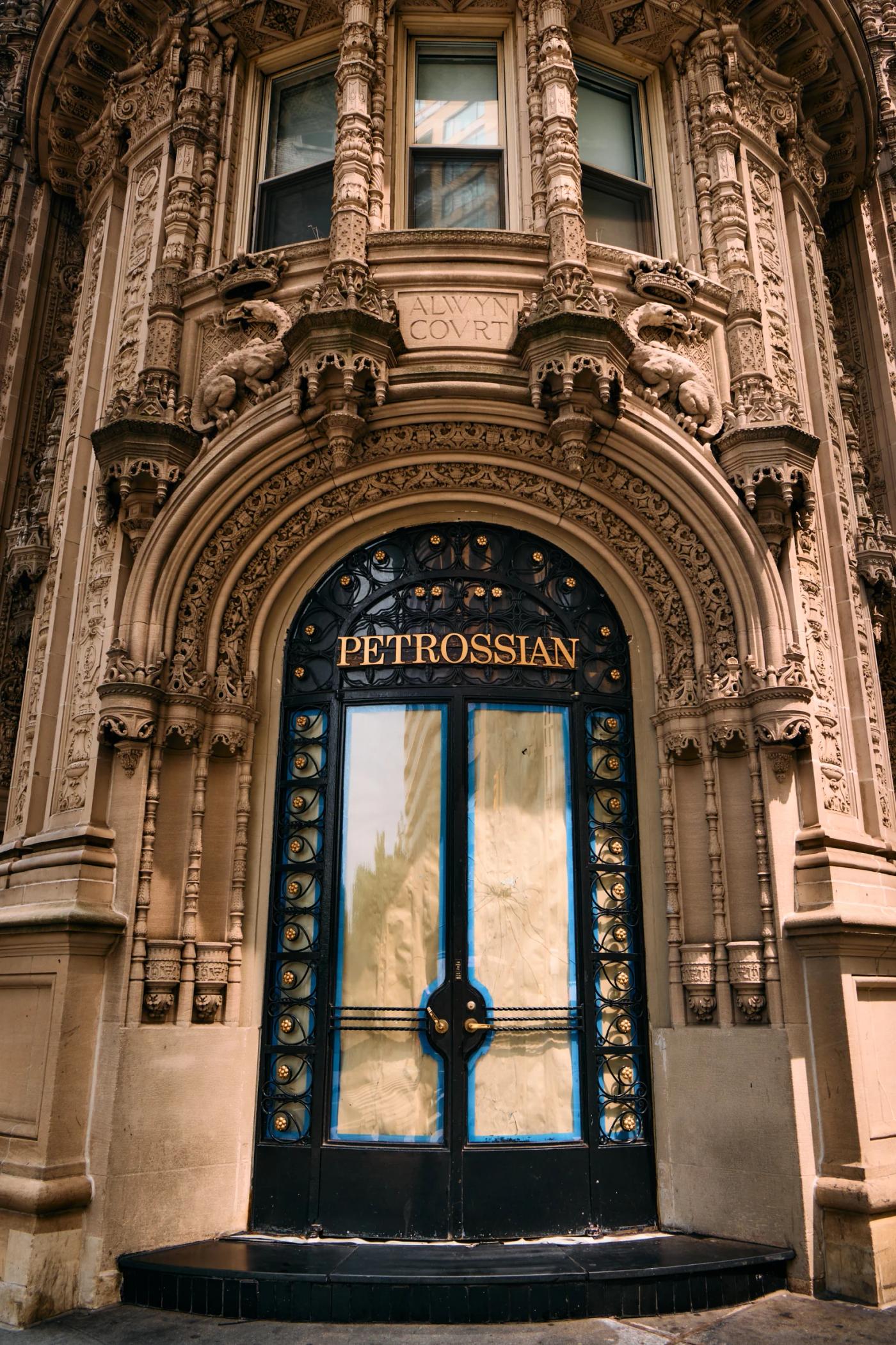 The image features the entrance of the "FREES STATION" building, showcasing its ornate facade and blue door with gold accents. The building is flanked