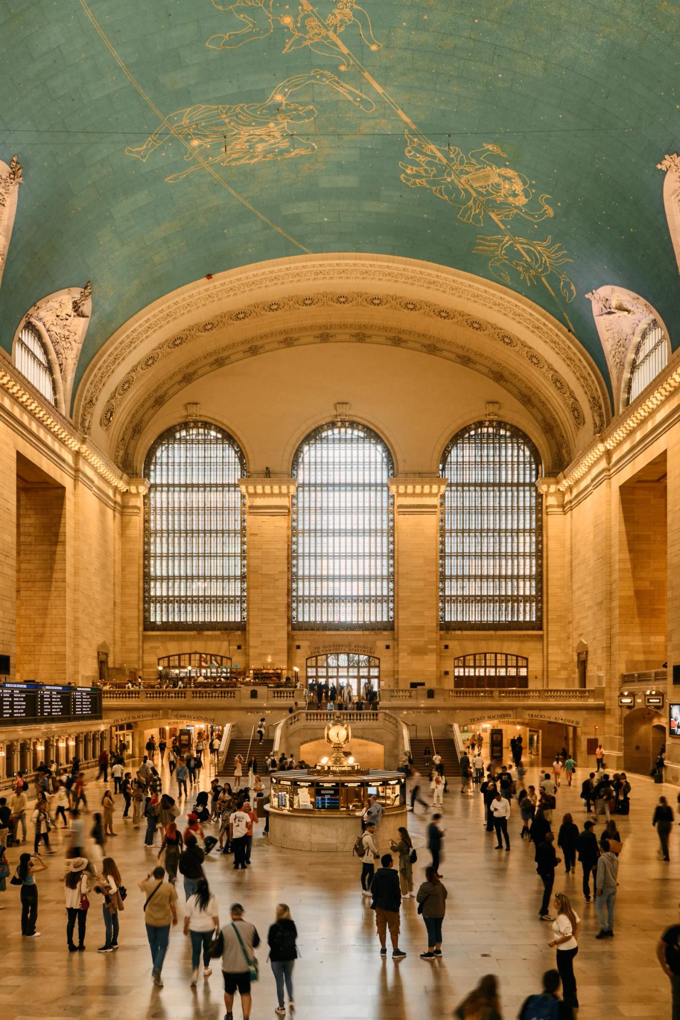 The image captures the grandeur of the Central St. Station in New York City, featuring a large, ornate dome with a map of the world above, arched wind