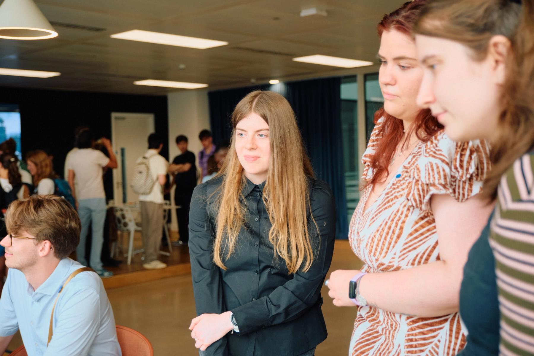 Access VFX community event 2026, three women watching something together across the room