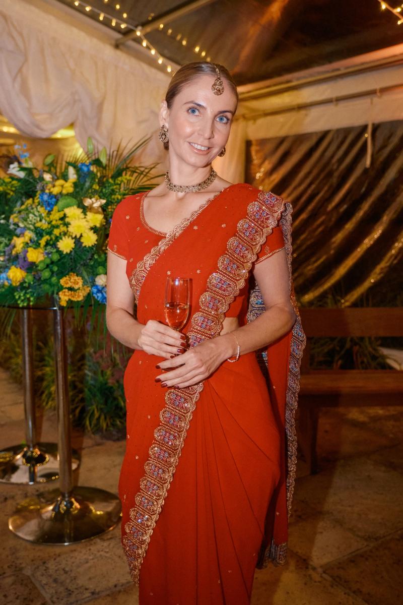 Portrait of a bride in a red bridal outfit at a wedding ceremony