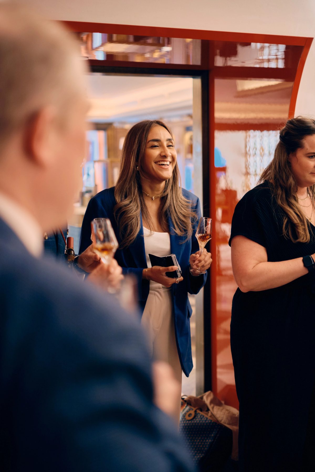 Woman speaking to guests during a wedding reception celebration