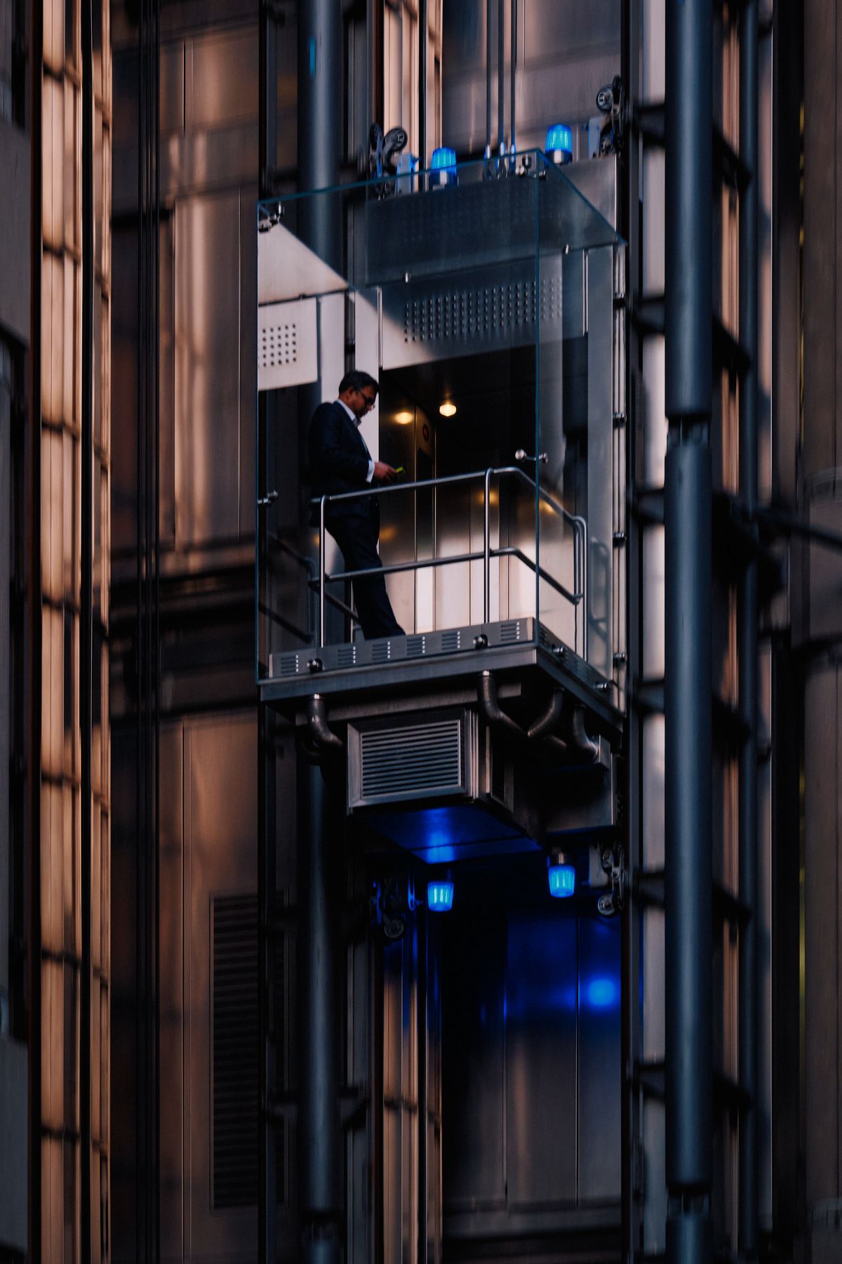 Big Ben Elizabeth Tower and Palace of Westminster at golden hour sunset with red London bus on Westminster Bridge over the River Thames