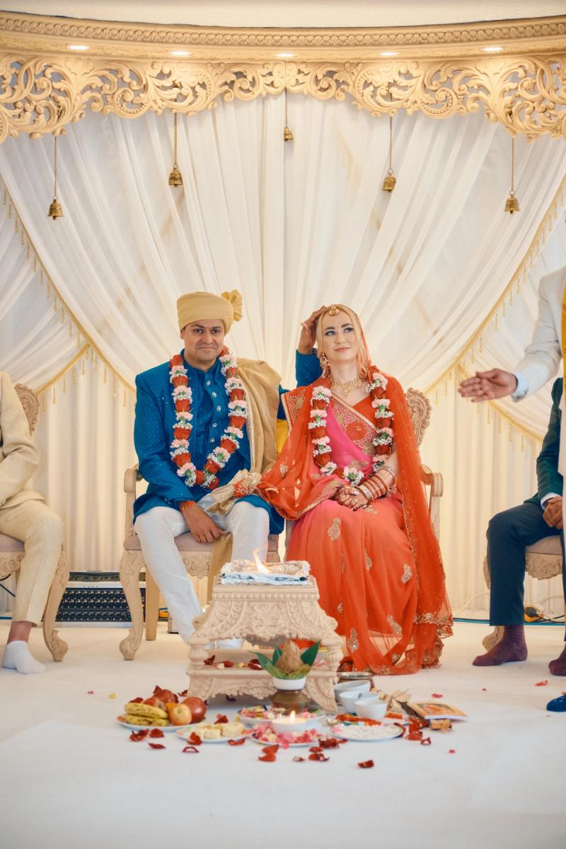 Family members dancing together during a lively wedding celebration
