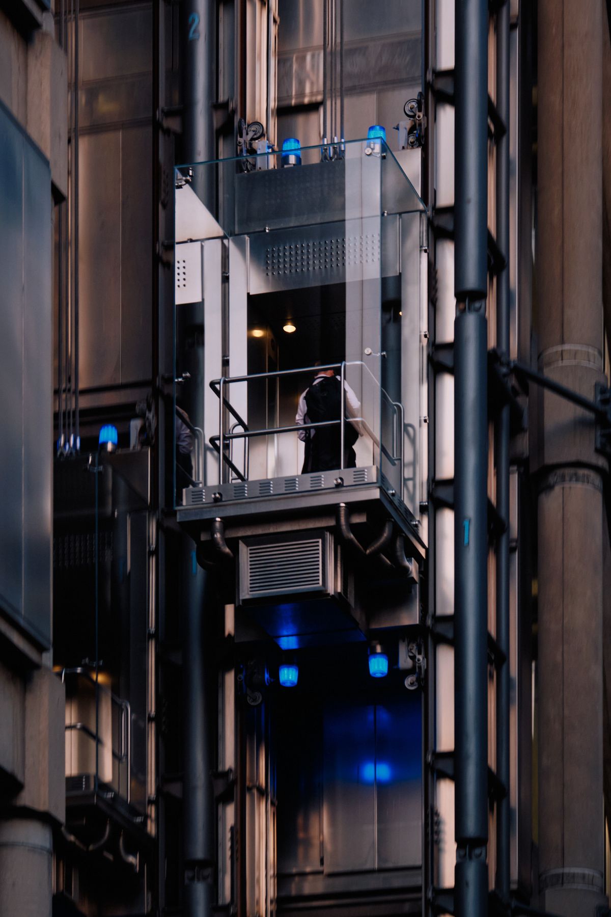 Aerial view of Manhattan skyline from high-rise skyscraper with diagonal steel bracing, overlooking Central Park and Hudson River at golden hour, New York City
