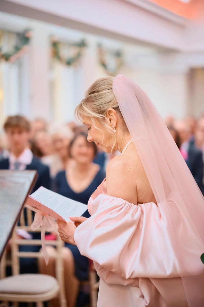 Candid portrait of a guest reacting emotionally during the ceremony