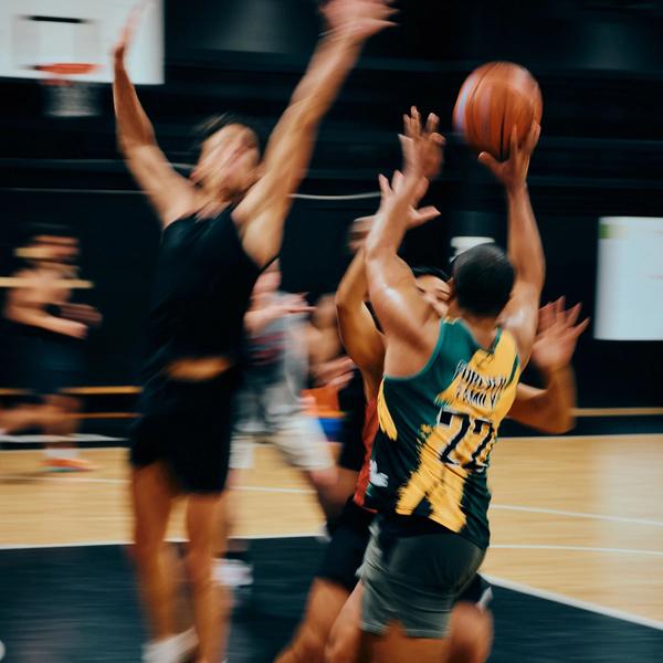 Professional sports photography showcasing athletic form and competitive intensity