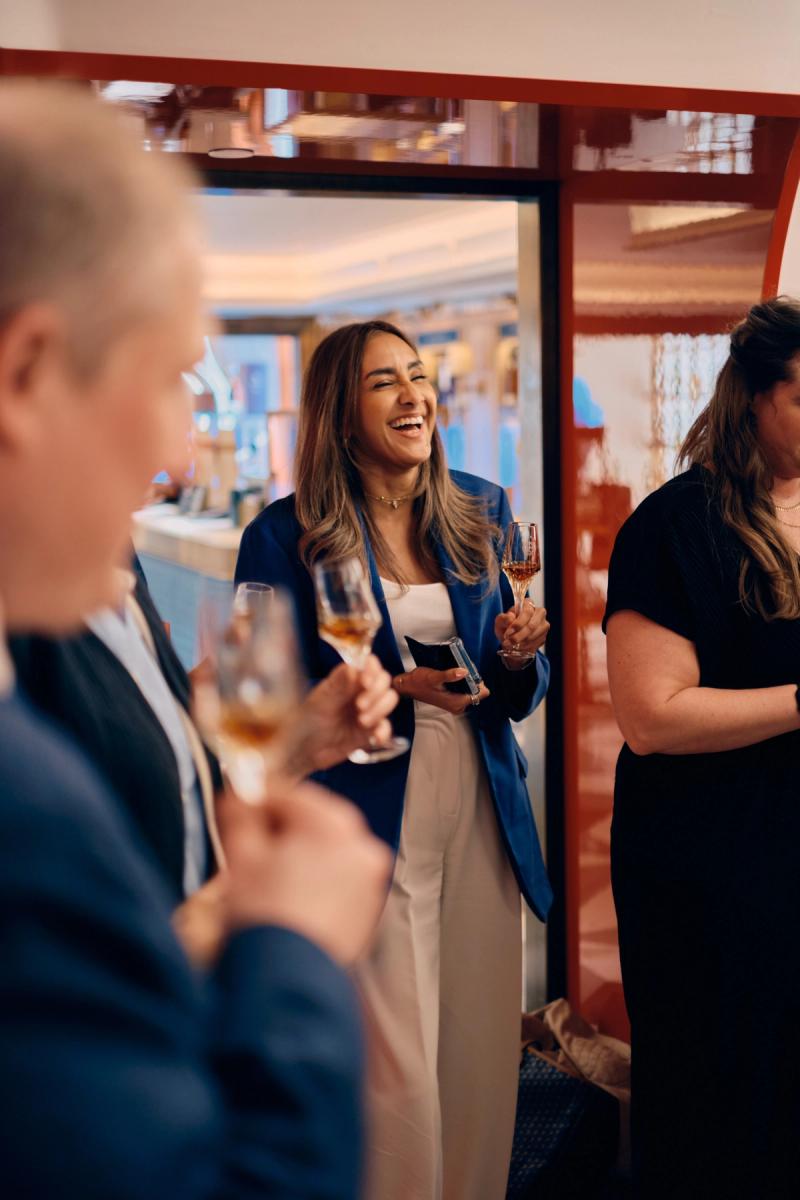 Wedding guests in conversation during an indoor event gathering
