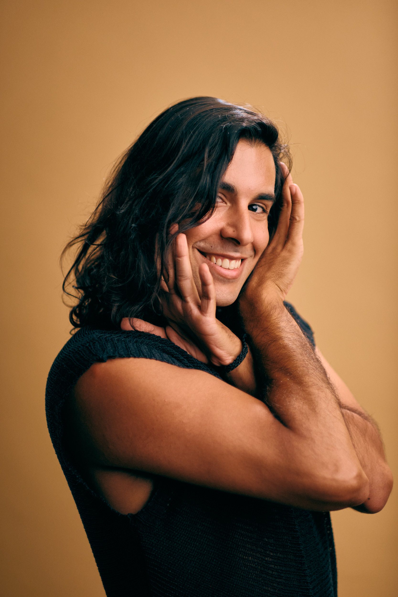 Editorial headshot photography of woman with confident expression and soft window light