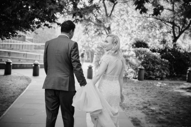 Black-and-white close-up of bride and groom sharing a moment