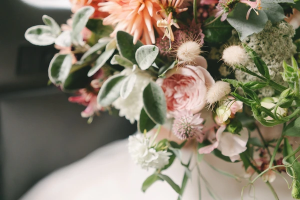Bridal bouquet — pink roses, coral flowers, silvery eucalyptus and delicate dried flowers
