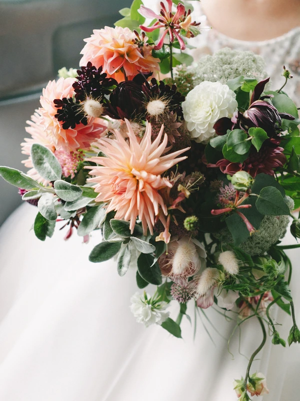 Bridal bouquet — azure and cream dahlias, dark burgundy flowers, white ranunculus and greenery