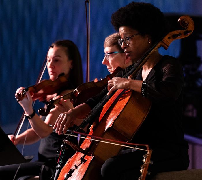 String players delivering a graceful performance, showcasing how carefully selected music can elevate the ambiance of any event.