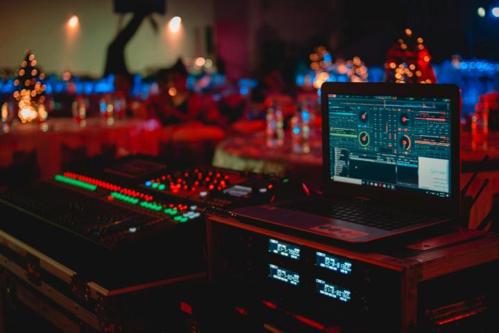 Event media production technology coordinating the audio and video for a corporate event.