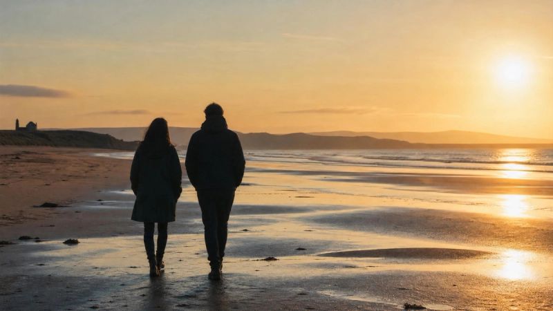 Two people walking together on a quiet Irish beach, representing connection and support for social anxiety and loneliness