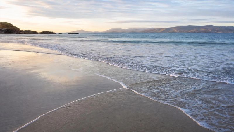 Waves overlapping on a quiet Irish beach, symbolising how social anxiety and low confidence feed into each other